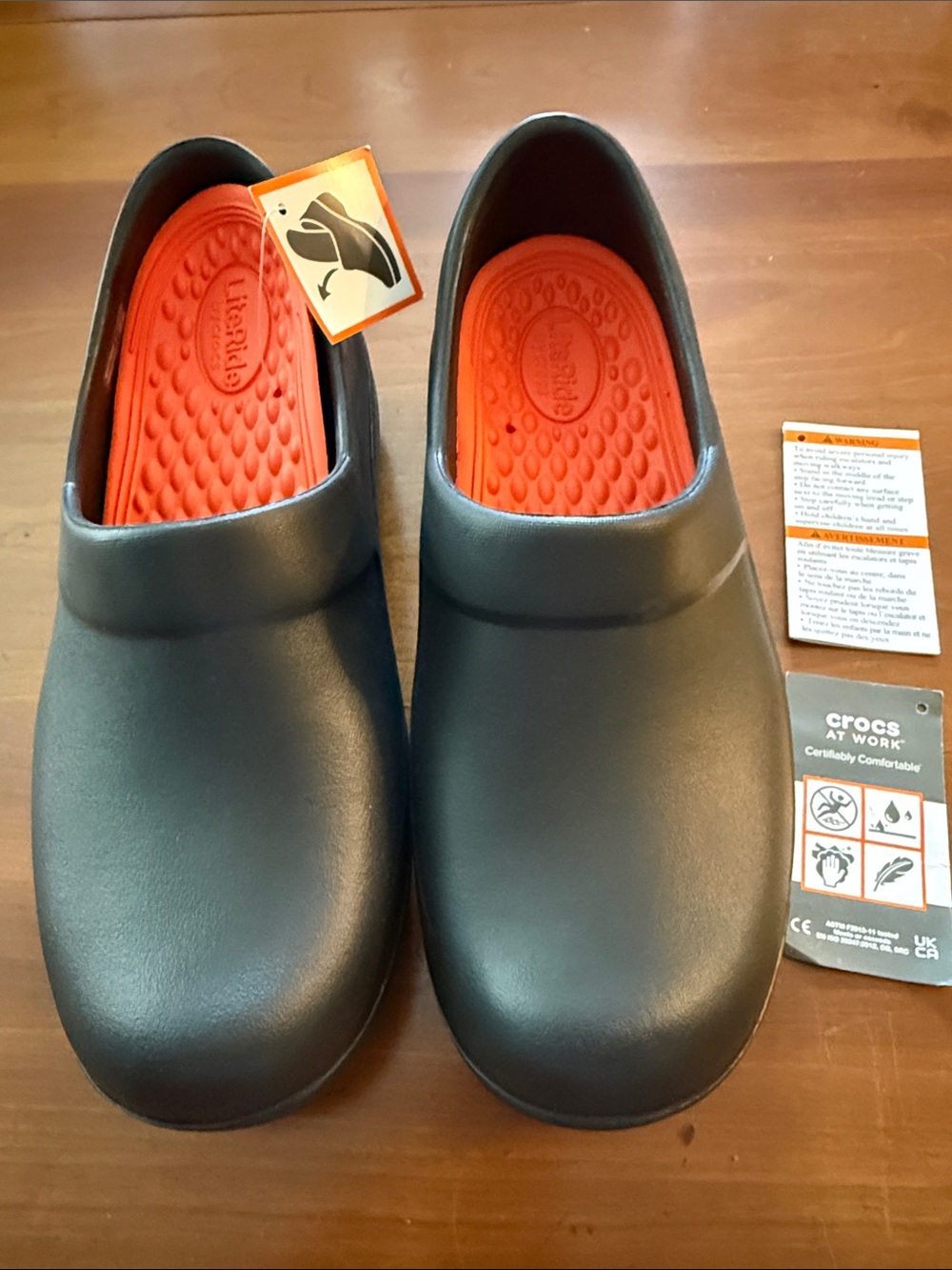 LiteRide by CROCS at Work. Slip-On Sneakers in Black with Orange Insole